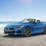 BMW Z4 at the beach with the top down.