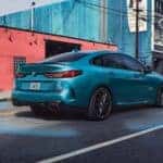 BMW 2 Series Gran Coupe in an urban backdrop.