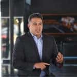 Frank Garcia sitting down on a stool for Veteran's Day shoot