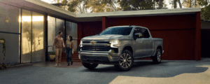 husband and wife walking out their Silverado