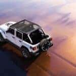 White 2026 Jeep Wrangler on the beach