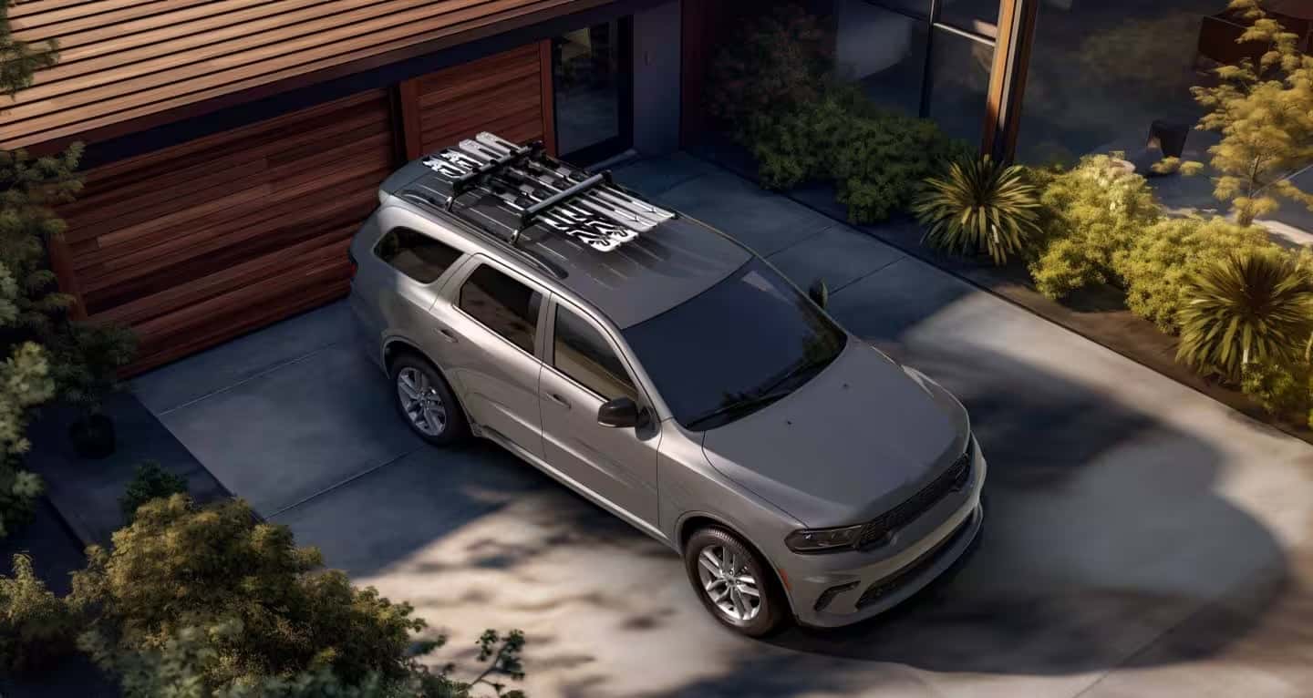 grey dodge suv parked in driveway aerial view
