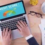 Person looking up credit score on their computer