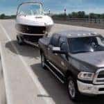 ram 2500 towing boat down highway