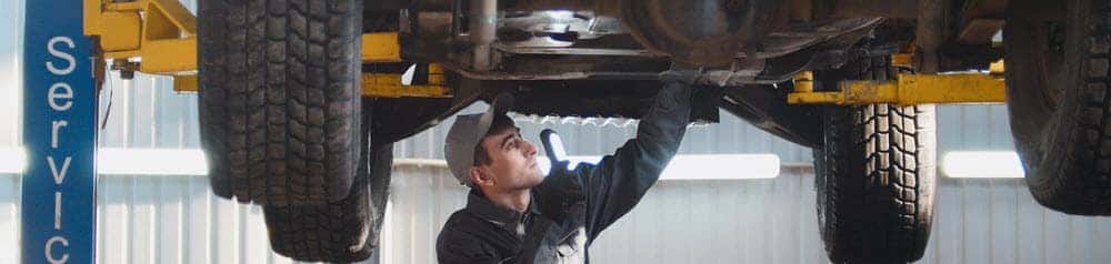 Mechanic Working on Car