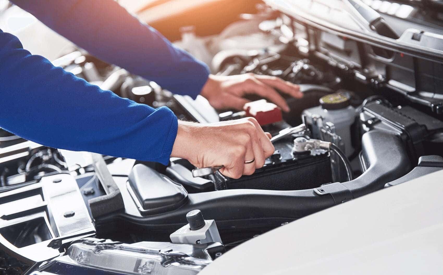 Mechanic Working on Car