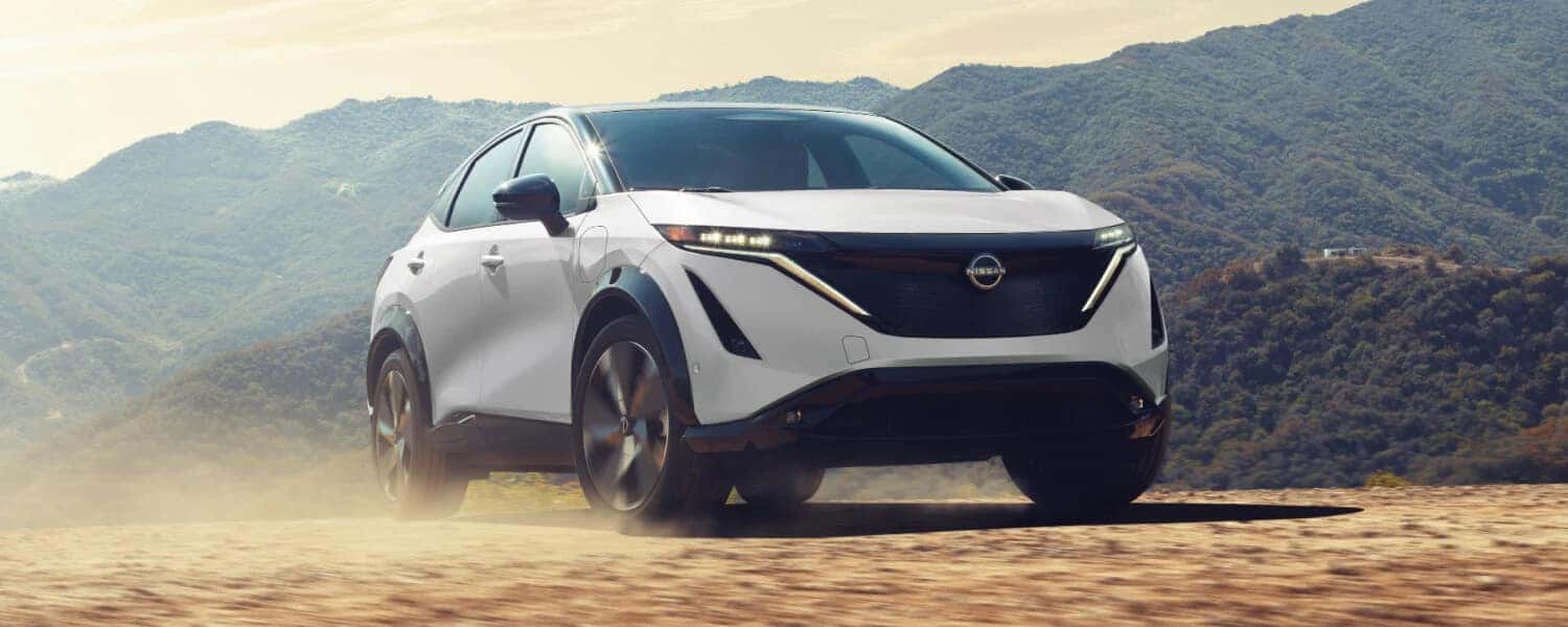 2025 Nissan ARIYA by Mountains with Trees