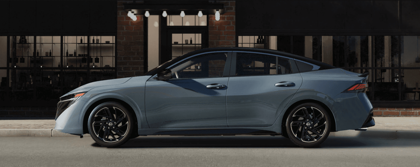 Side profile of a 2026 Nissan Sentra parked by a curb