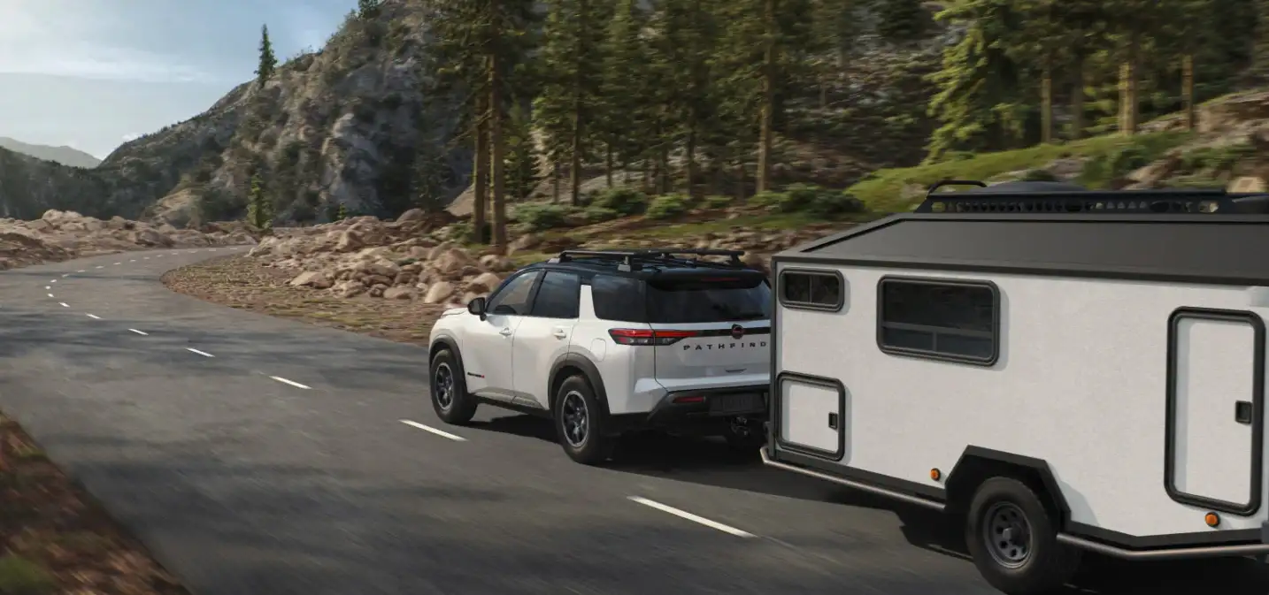 2026 Nissan Pathfinder towing on a curved road