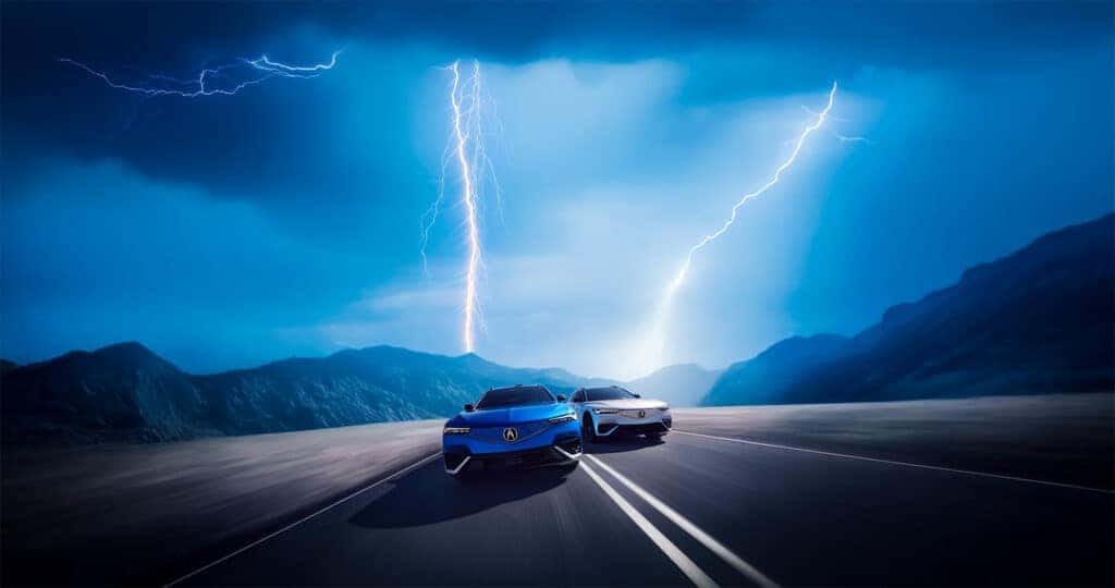 2024-Acura-ZDX-Type-S-and-A-Spec-model-driving-through-desert-mountains-with-lightning-coming-down-from-the-sky