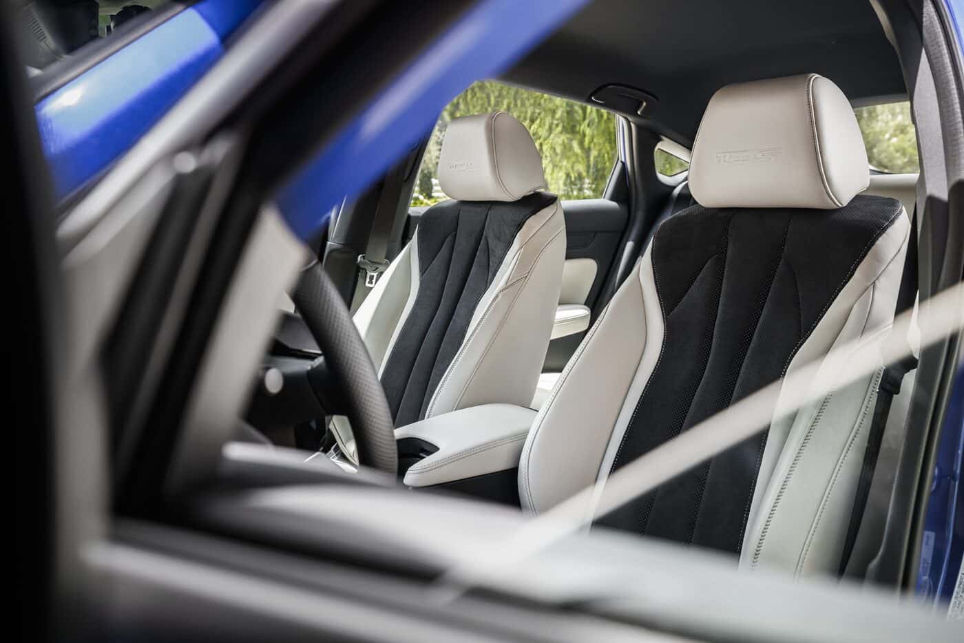 Perforated Ultrasuede sport seats with Type S embossed headrests inside the 2026 Acura Integra Type S