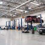 Acura technicians working in the service bays at Elk Grove Acura