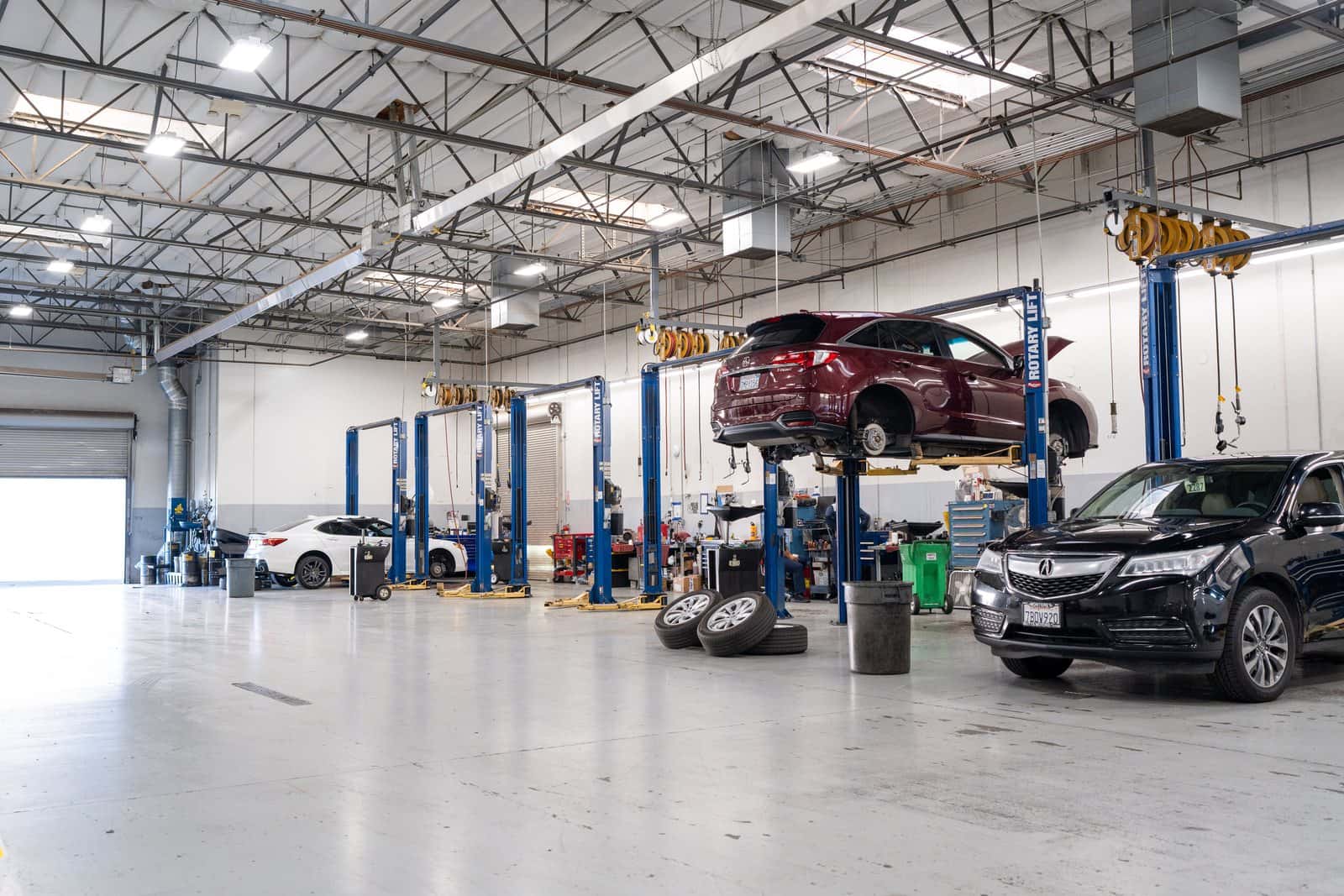 Acura technicians working in the service bays at Elk Grove Acura