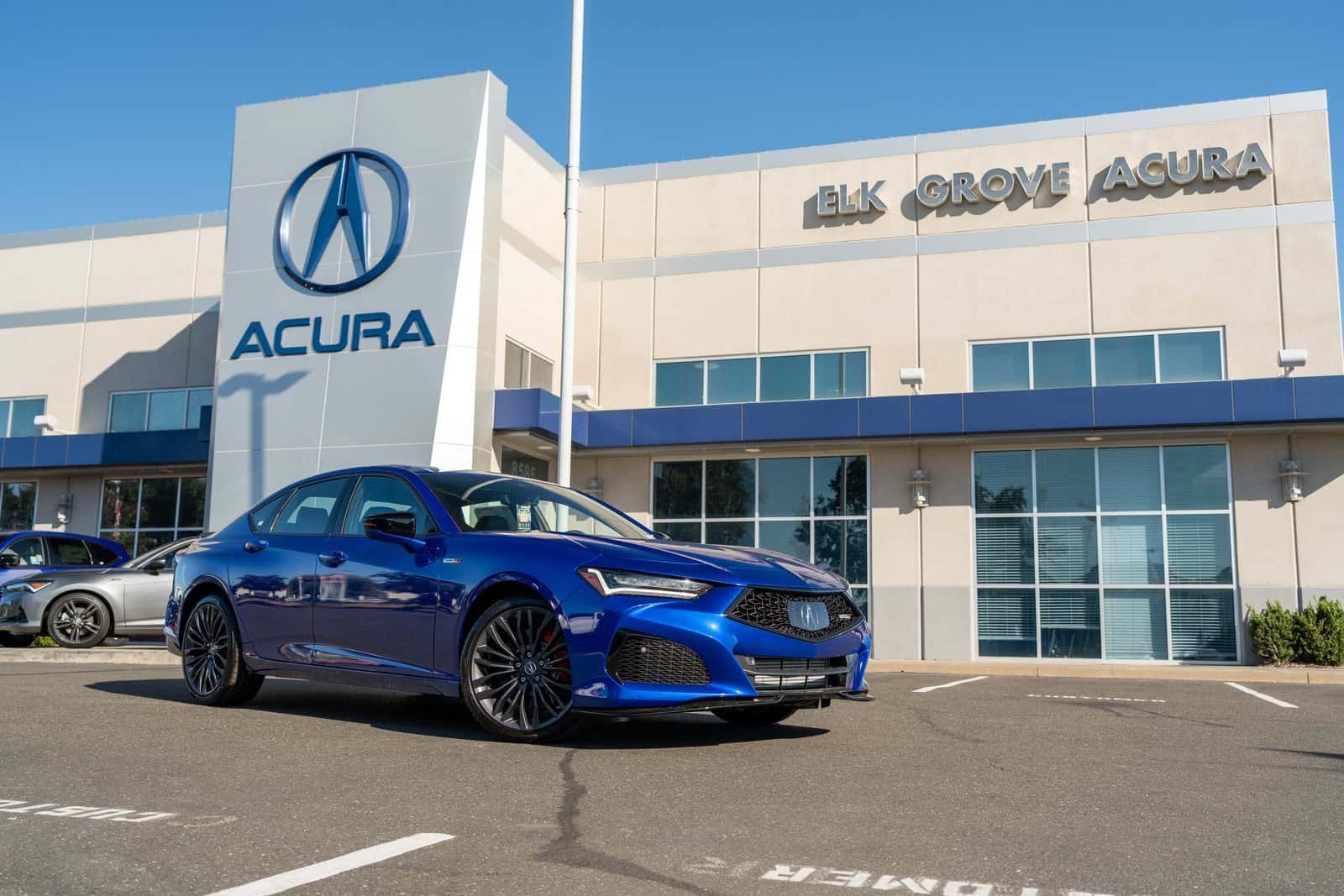 Acura sedan parked outside the Elk Grove Acura showroom, a short drive from West Sacramento