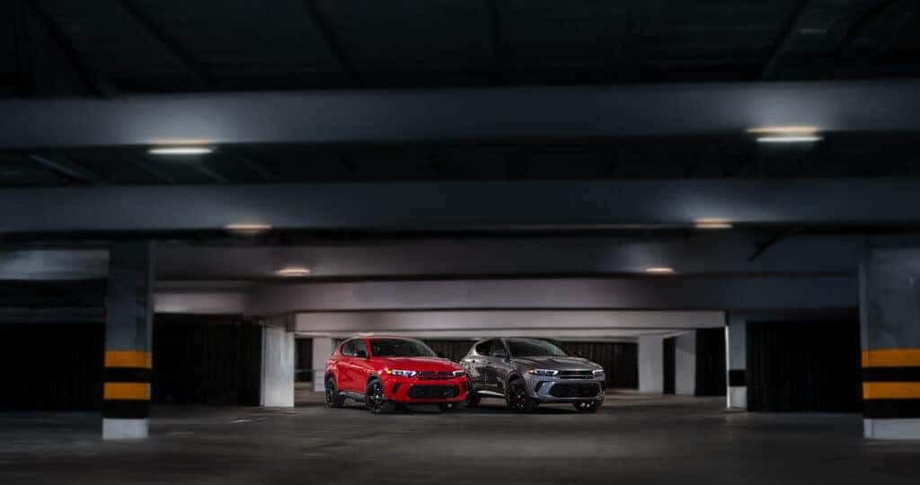 2025-Dodge-Hornet-R-T-and-R-T-Plus-parked-next-to-eachother-in-a-dark-parking-garage