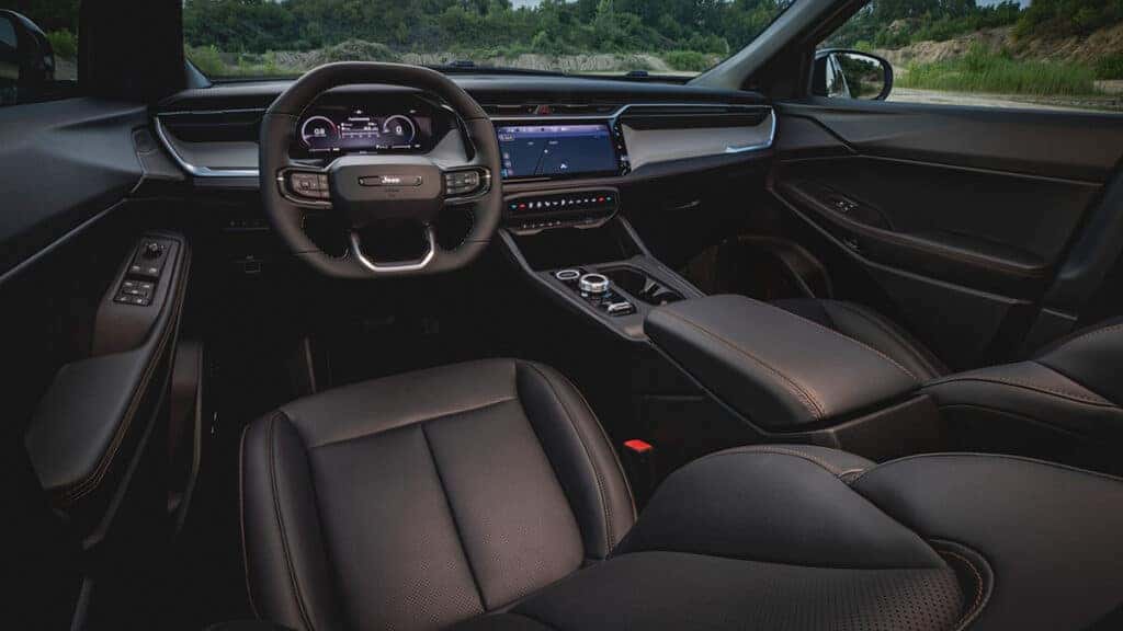 2026 Jeep Cherokee interior photo showing front cabin in black leather