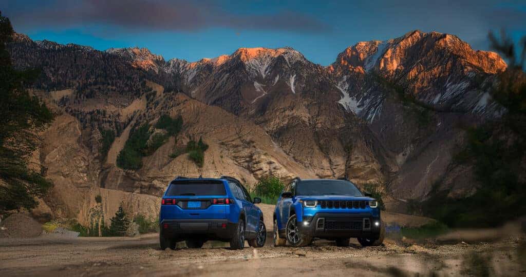 All new 2026 Jeep Cherokee in in blue parked side by side showing front and rear view