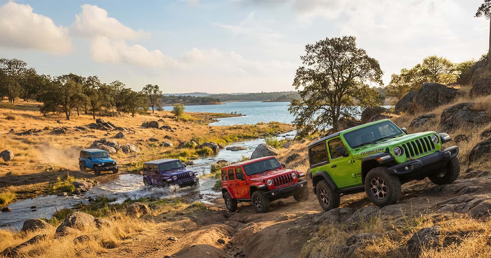 Jeep Wrangler driving on sandy terrain near a Southern California beach