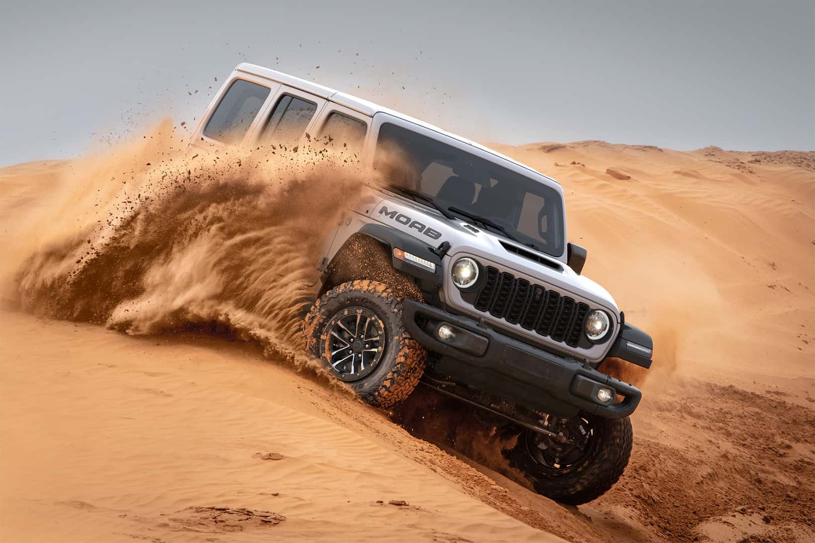 Moab 392 2026 Jeep Wrangler Trims Level driving through sand dunes
