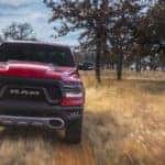 A red 2019 Ram 1500 screams down a southern Texas trail