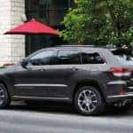 A 2019 grey Jeep Grand Cherokee is parked at a cafe in Ennis, TX.