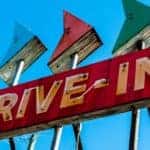 A vintage drive-in sign is shown.