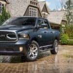 A 2018 Ram 1500 Limited Tungsten Edition is parked in front of an Ennis, TX, home.