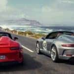 2019 Porsche 911 speedster cars racing down mountain road