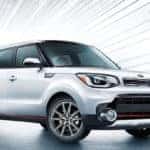 white kia soul with fluorescent background