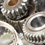 Close-up of automobile engine steel gears and bearings disassembled for repair at car service station