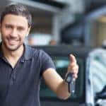 Man selling his car and handing off the keys