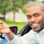 Man Holding Key Outside of Car