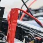 Car battery with jumper cables attached