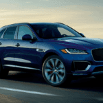 Blue 2020 Jaguar F-PACE driving on highway
