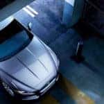Aerial view of XE leaving parking garage at night