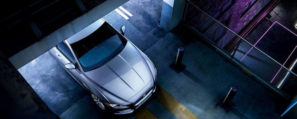 Aerial view of XE leaving parking garage at night