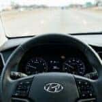 Hyundai dashboard with illuminated check engine light while driving