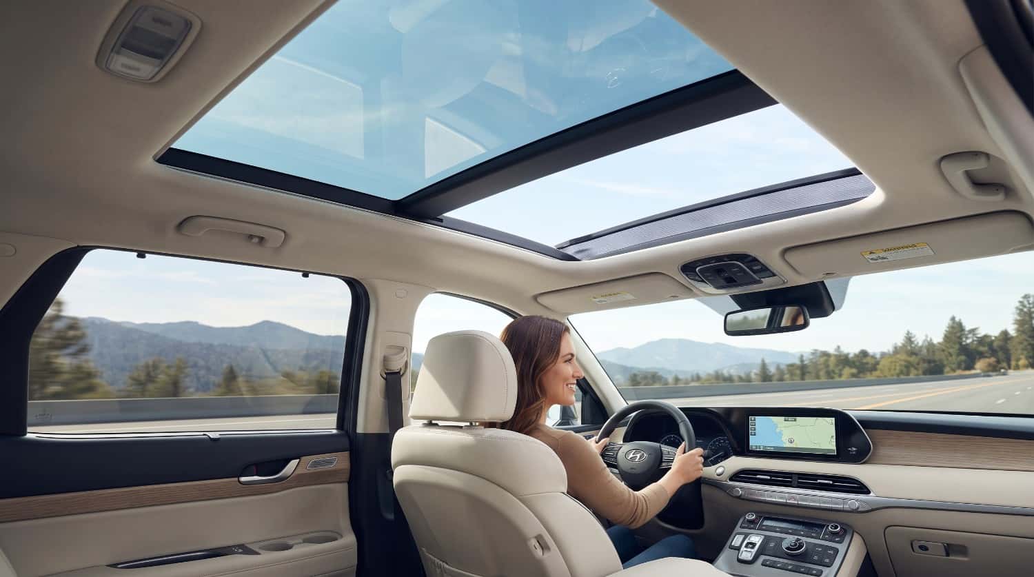 Modern SUV interior cabin view highlighting moonroof vs sunroof design differences