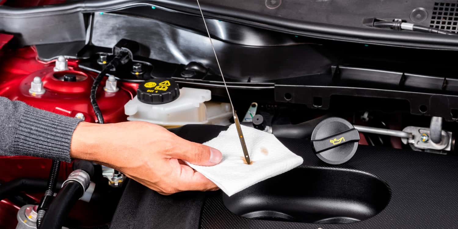 Car maintenance checklist monthly inspection showing tire pressure and oil level check