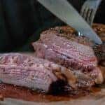 person cutting steak in cape girardeau, mo