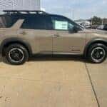 tan nissan pathfinder SUV parked at John Sinclair Nissan in cape girardeau, mo