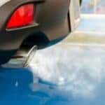 white smoke coming from a car's tailpipe
