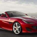 Red Ferrari Portofino against a gray sky