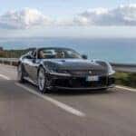 Ferrari 12Cilindri driving on a highway by the ocean