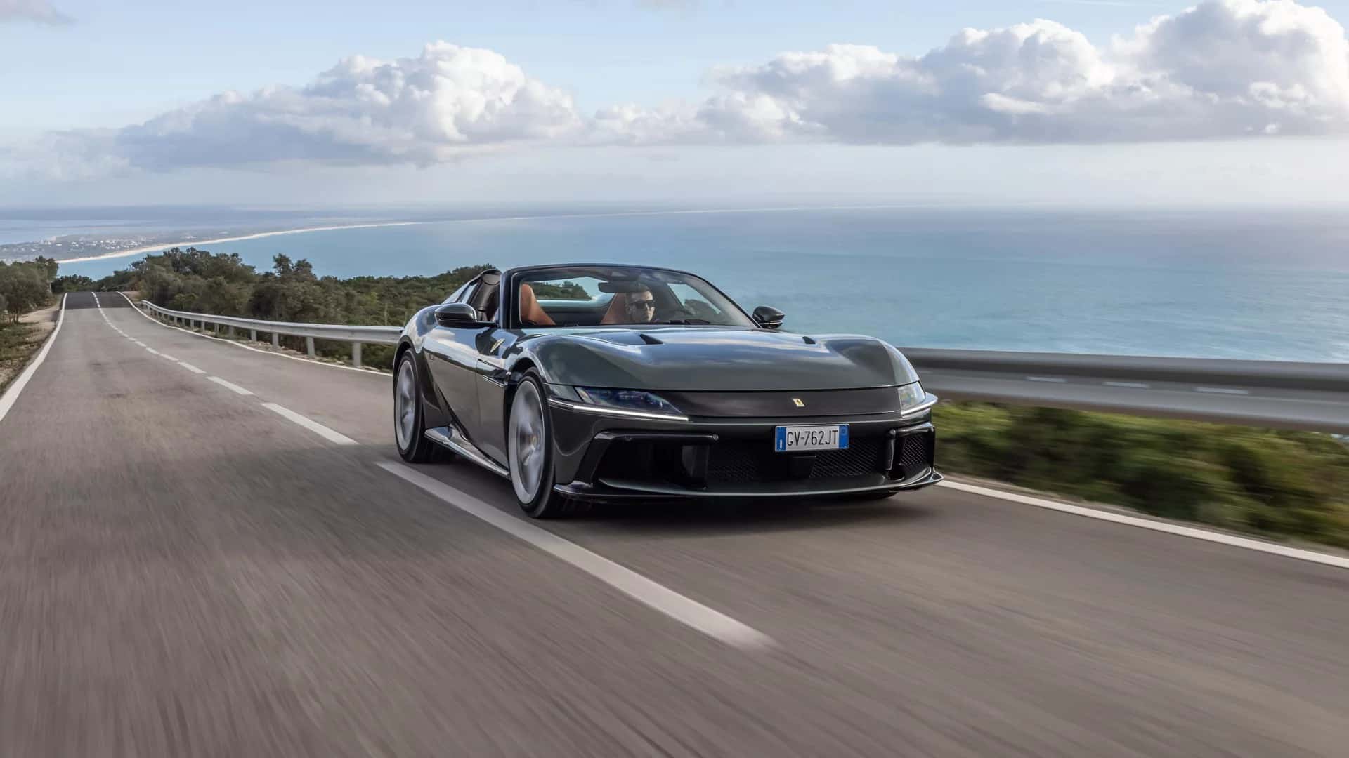 Ferrari 12Cilindri driving on a highway by the ocean