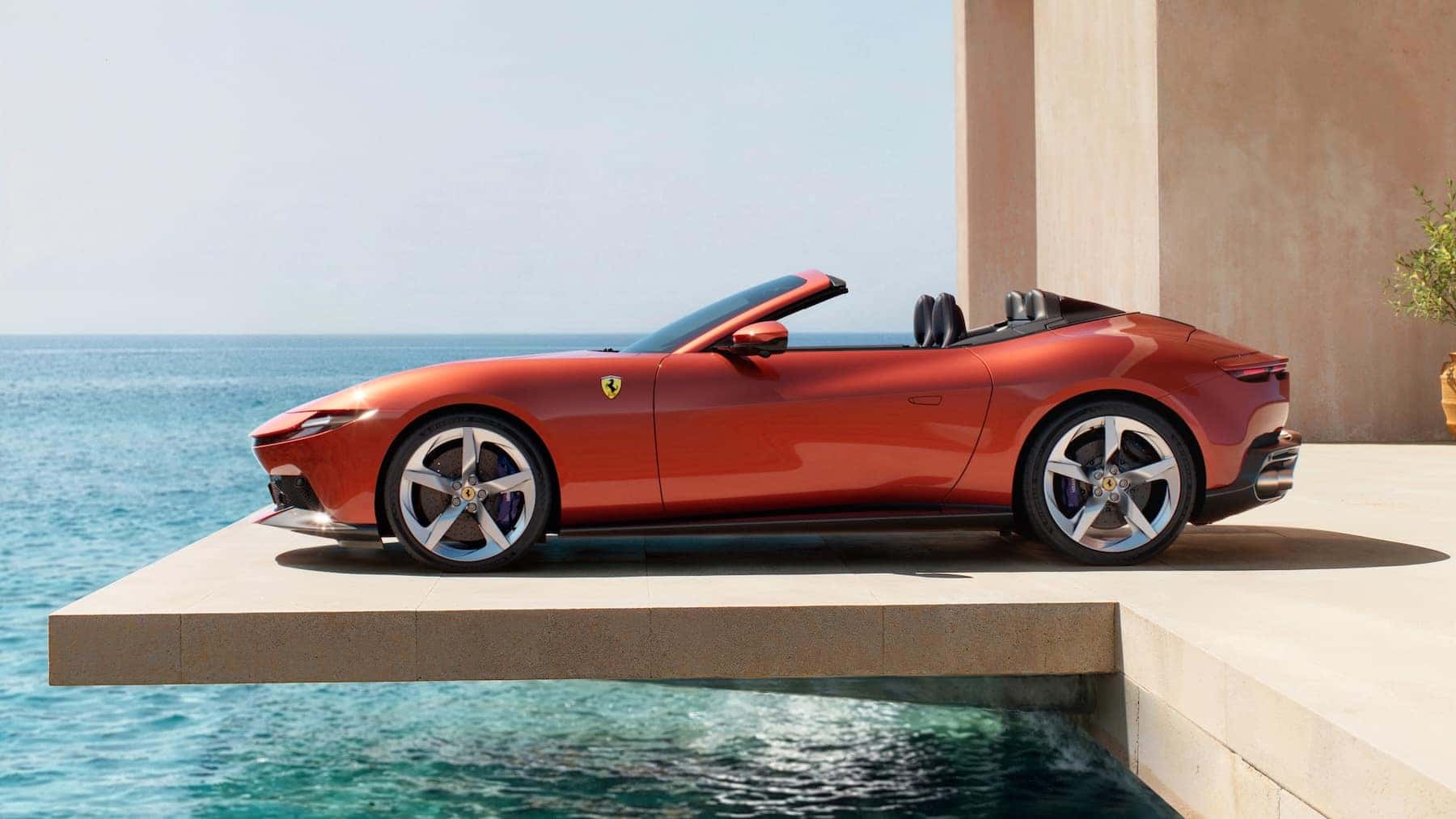 Ferrari Amalfi Spider side angle view by the water