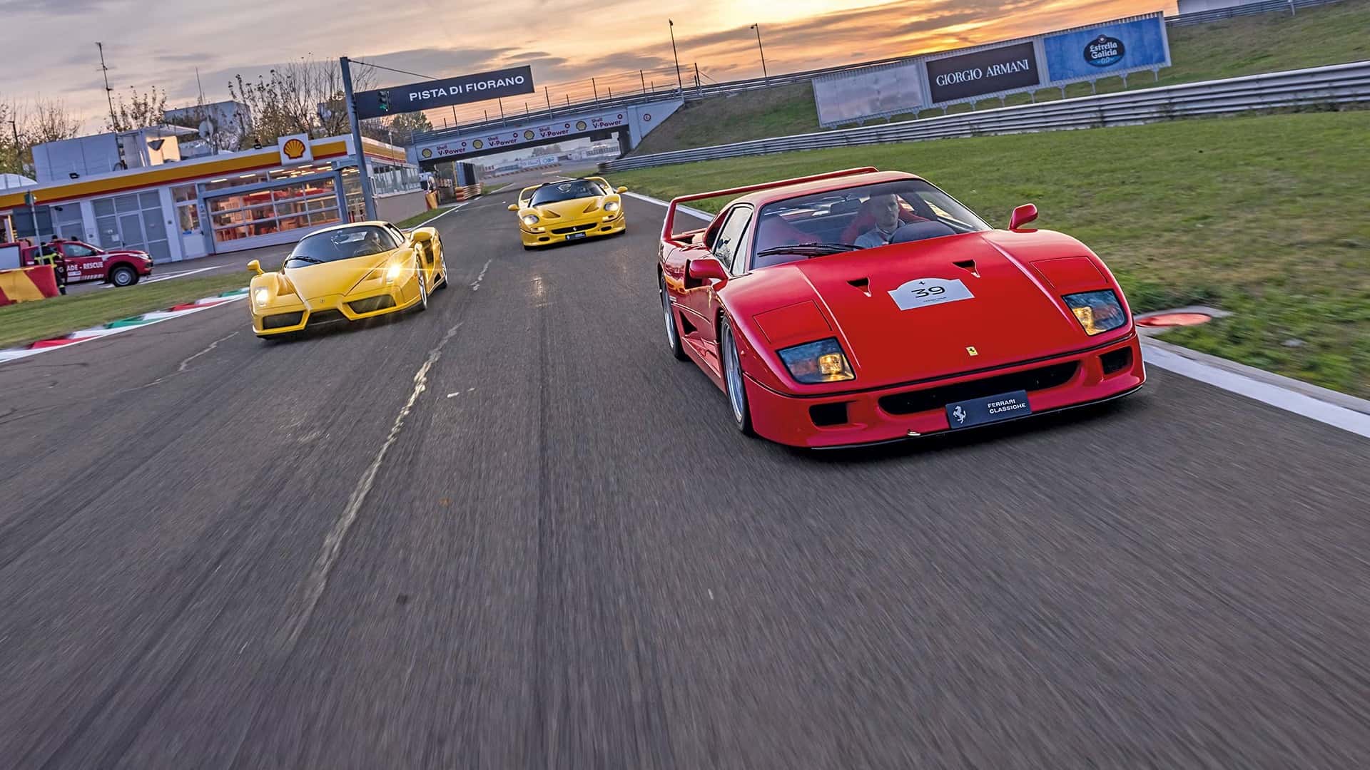 Ferrari models racing on a track