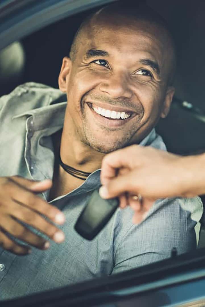 Man being given keys