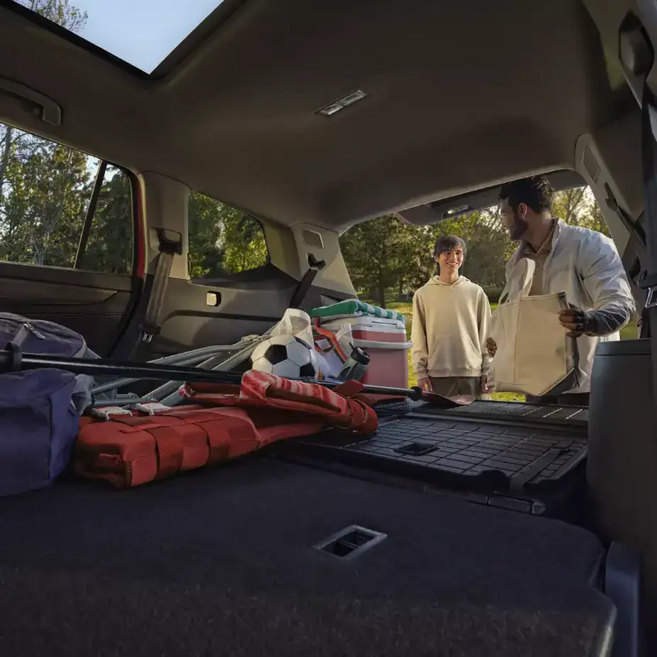 2026 Volkswagen Atlas cargo area loaded with sports equipment and family gear, demonstrating storage capacity