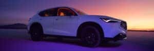 Acura Adx with a sunset in the background